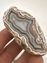 Load image into Gallery viewer, Kentucky Agate white/grey/pink with floater polished half specimen
