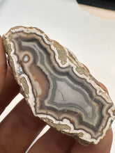 Load image into Gallery viewer, Kentucky Agate white/grey/pink with floater polished half specimen
